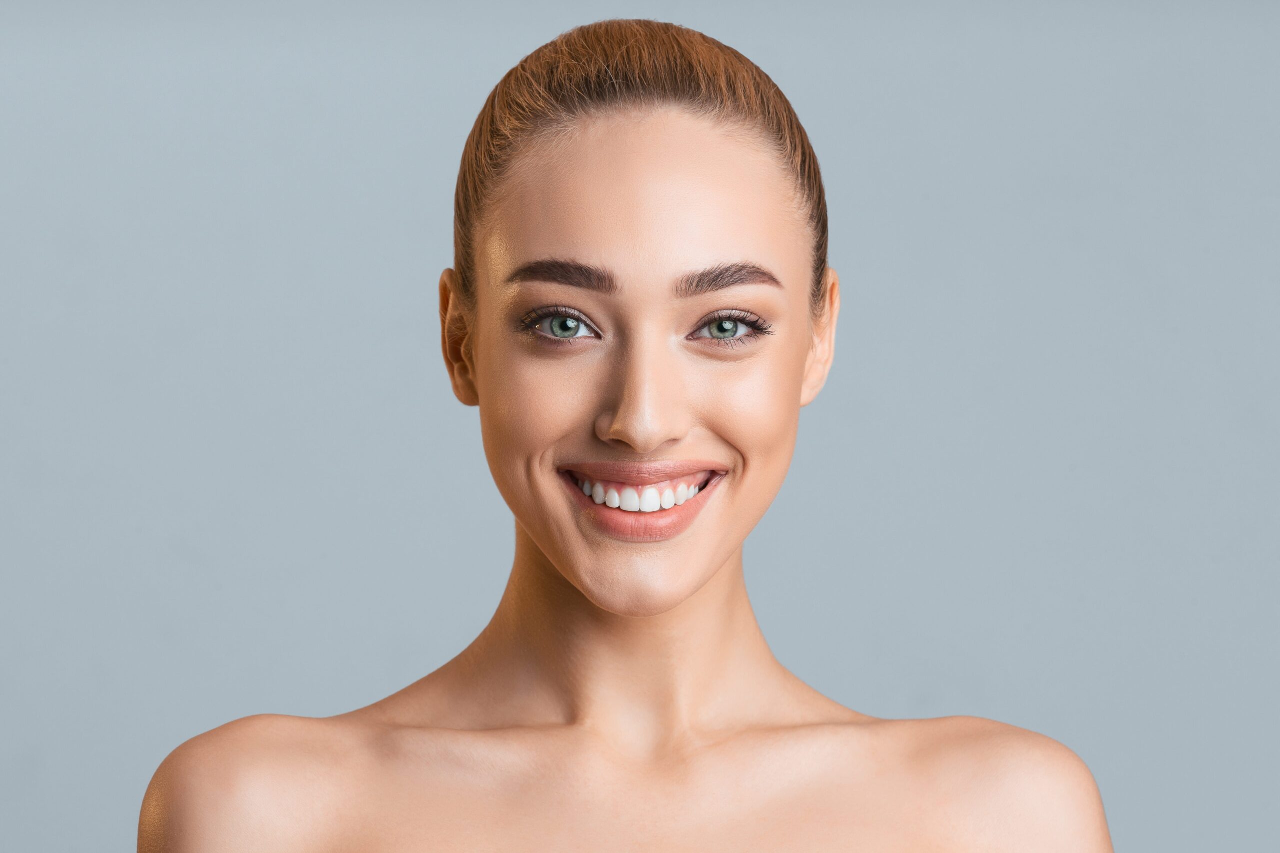 Patient smiling after cosmetic dentistry treatment