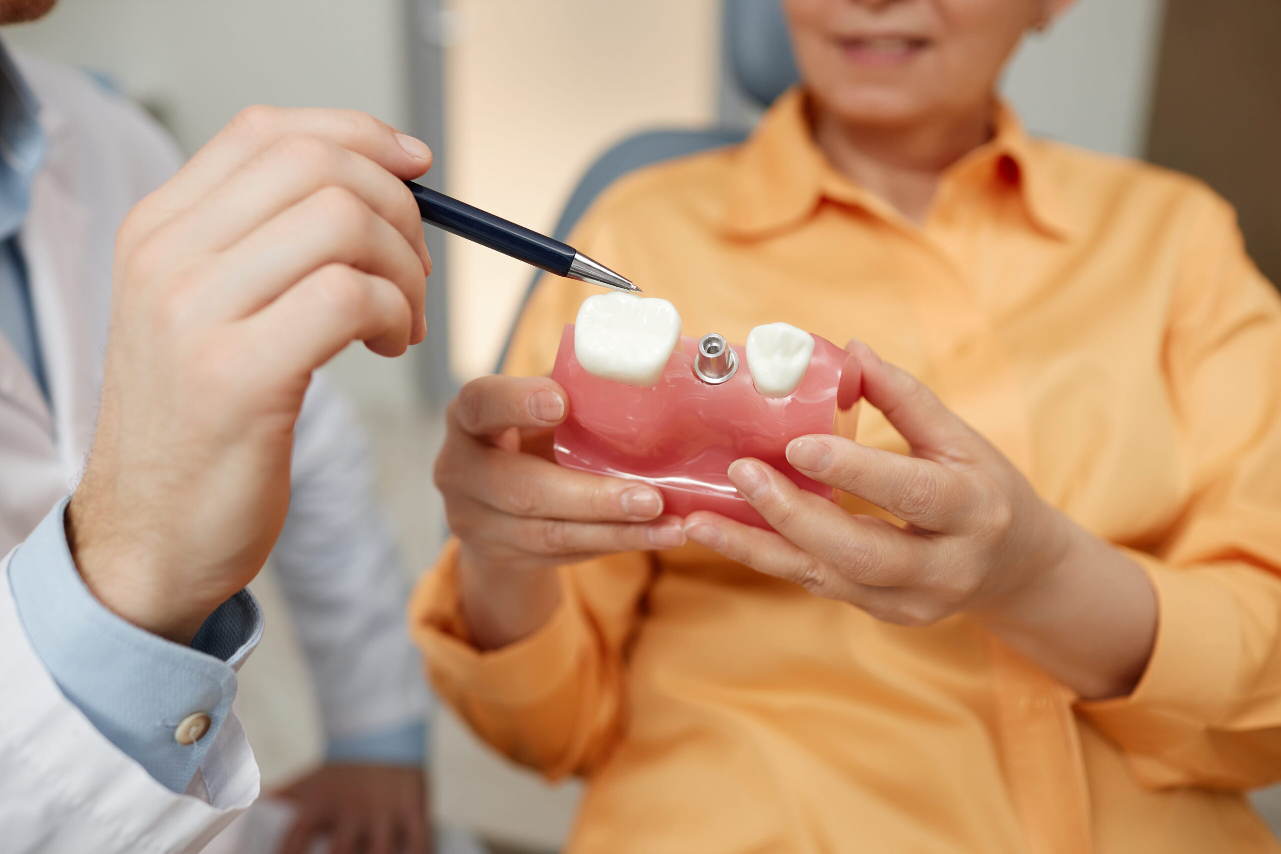 Periodontist in Portland OR reviewing dental implant recovery